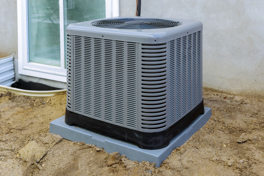 air conditioning outdoor unit sitting outside of new build