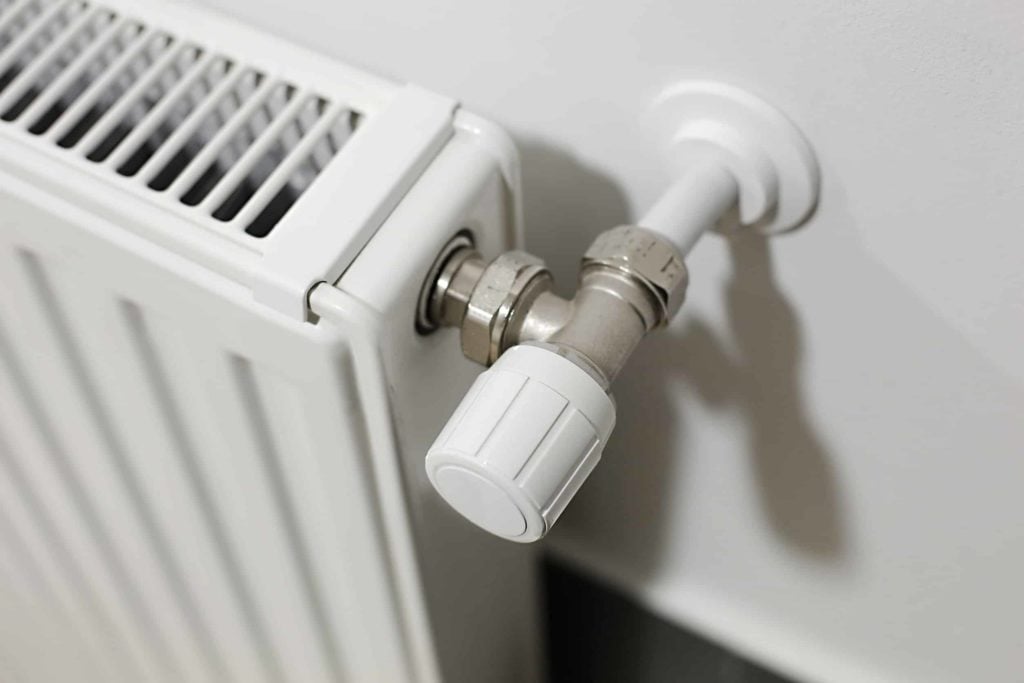 Heating radiator detail against white wall