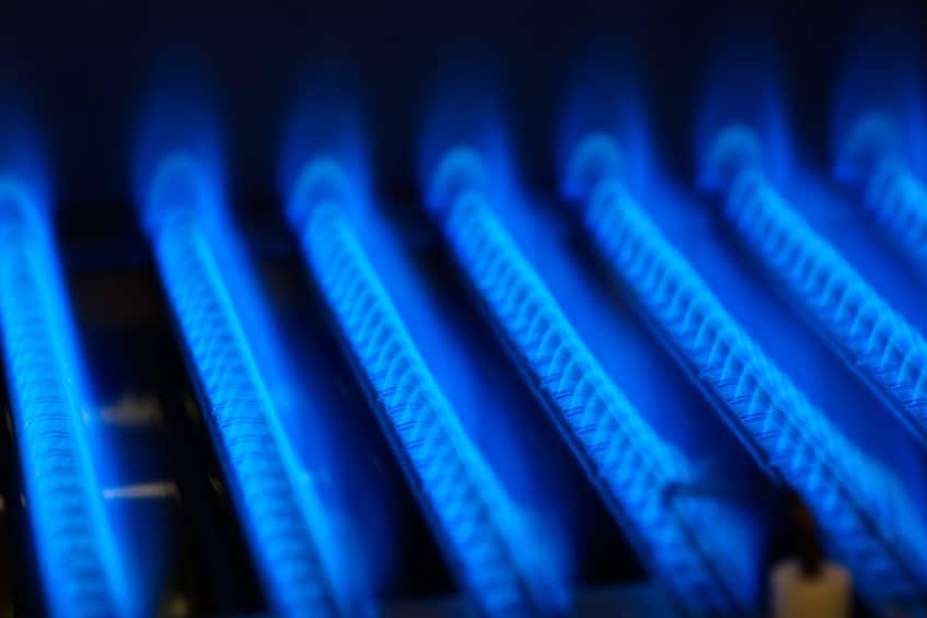 Propane flame inside of gas boiler furnace