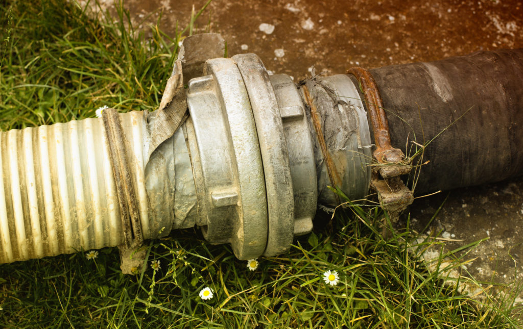 Sewage pipes for extracting septic water from cesspit in courtyard