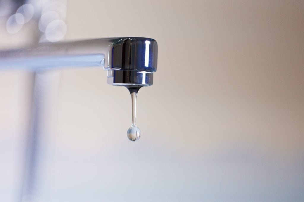Faucet dripping to protect pipes from cold weather